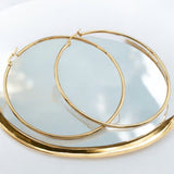 The large hoops bring a touch of glamour to any outfit, while the stainless steel material ensures long-lasting wear.