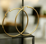 The large hoops bring a touch of glamour to any outfit, while the stainless steel material ensures long-lasting wear.