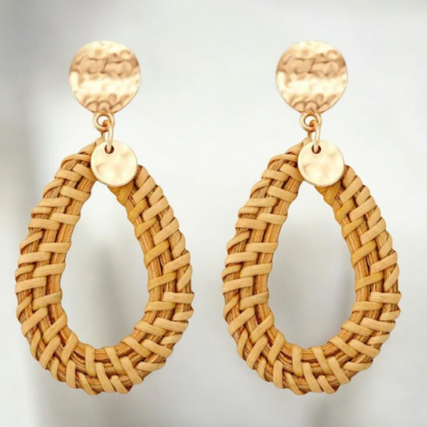 Expertly crafted from natural rattan, these handmade earrings feature bold circle drops that add a unique touch to any outfit. 